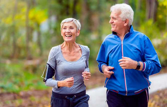 old couple jogging and laughing for some reason